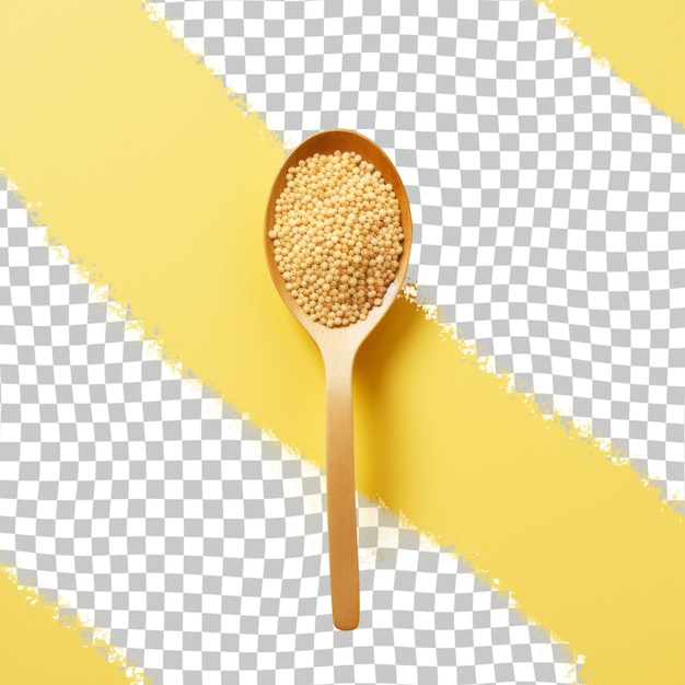 A spoon with rice in it sits on a yellow background