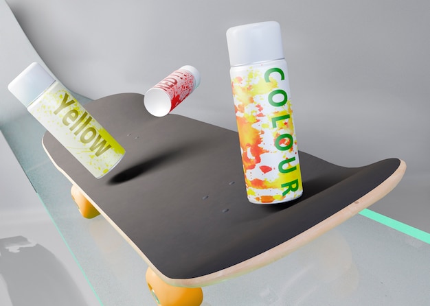 Spray cans on top of skateboard