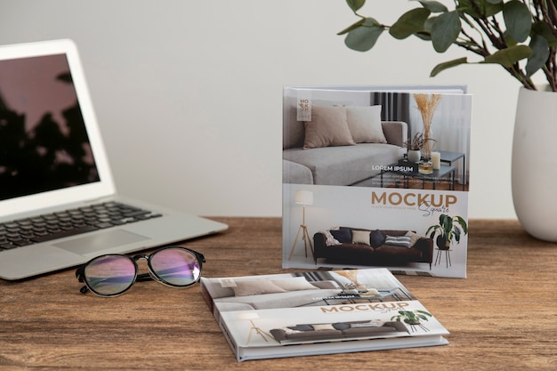 Square book mock-up on wooden office desk