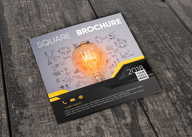 PSD square brochure mockup on wooden surface