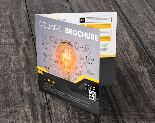 PSD square brochure mockup on wooden surface