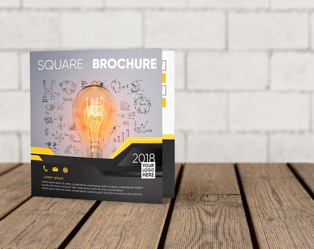 PSD square brochure mockup on wooden surface