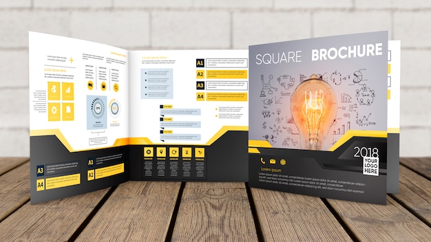 Square brochure mockup on wooden surface