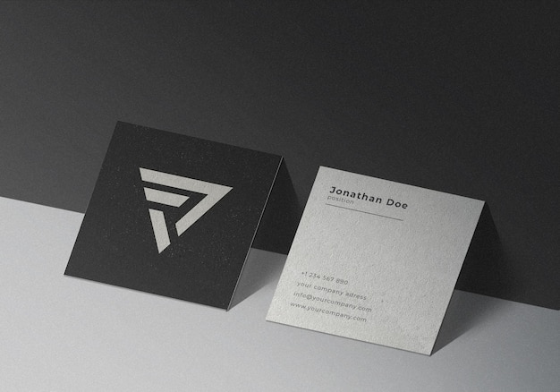 square business card mockup on black textured background