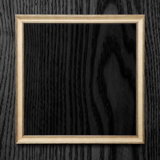 PSD square frame on black wooden texture background