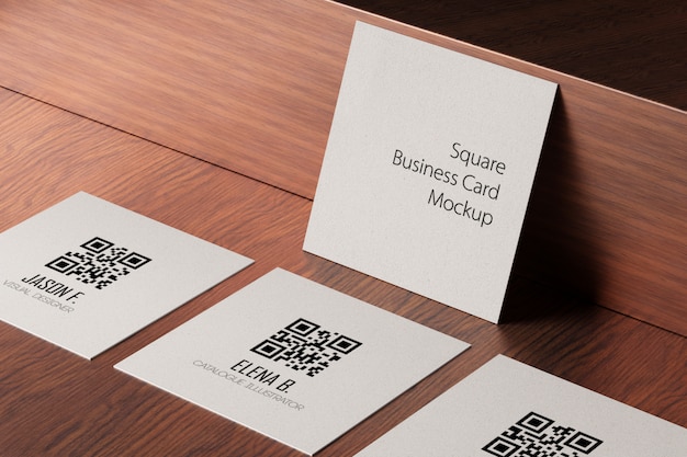 PSD square paper business cards mockup on wooden table