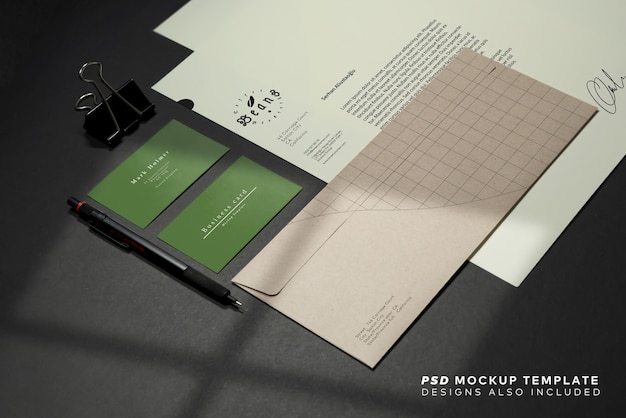 PSD stationery branding mockup template with red a4 letterhead, business card, envelope, note bookpencil.  dark background real photography