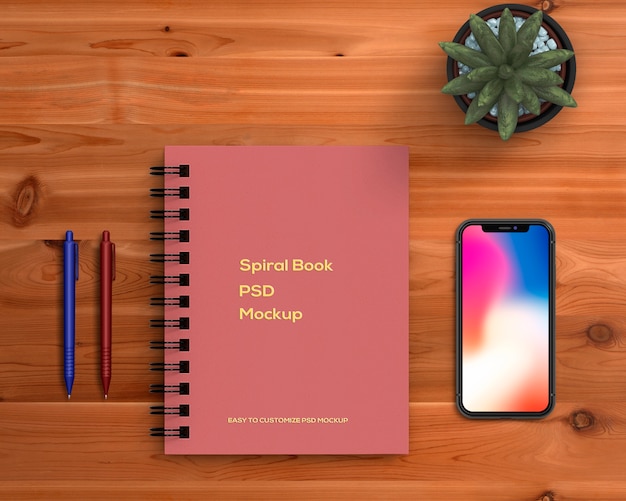 Concetto di cancelleria con mockup del libro a spirale