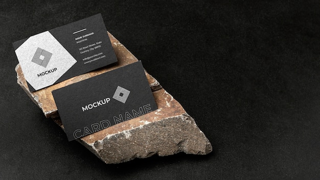 PSD stationery mock-up on dark concrete with rugged rock