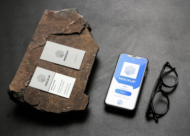 Stationery mock-up on dark concrete with rugged rock