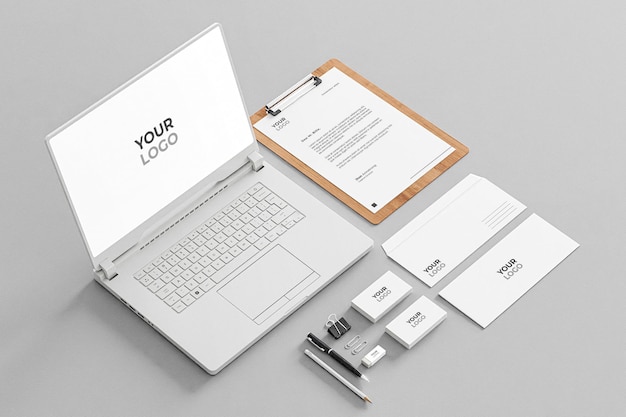 Cancelleria mockup white business company con laptop realistico