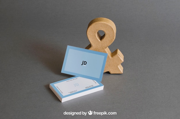 stationery mockup with business cards in front of ampersand