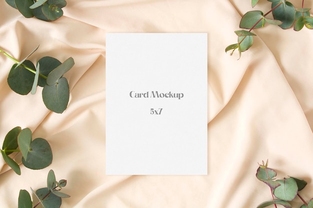 Stationery paper mockup with eucalyptus leaves