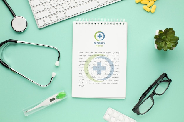 Stethoscope and notebook on medic desk