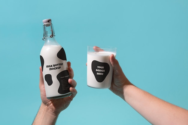 PSD still life of milk bottle mockup held in hand