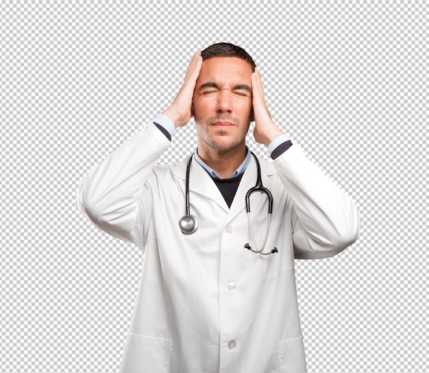 Stressed doctor against white background