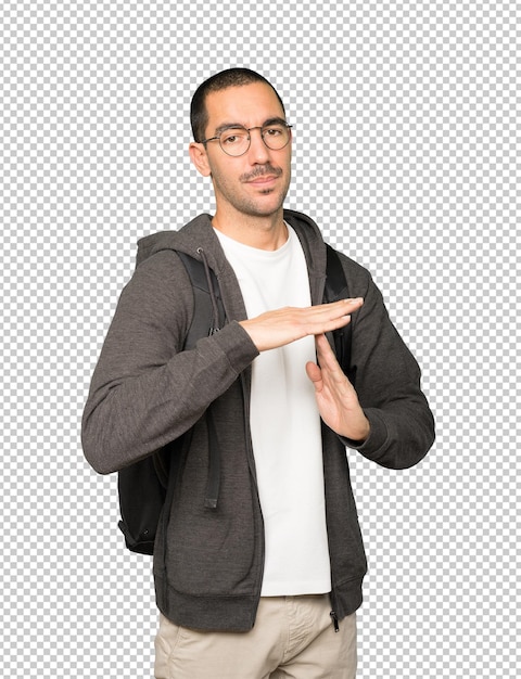 Stressed student making a time out gesture with his hands