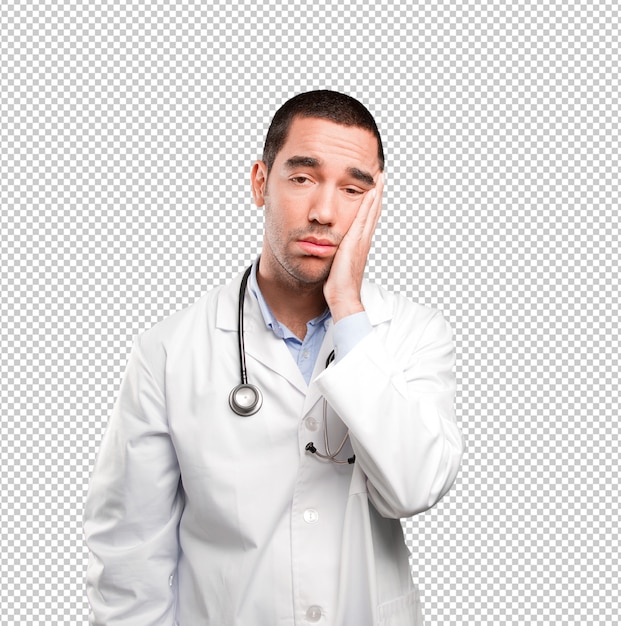 Stressed young doctor with a gesture of ansiety