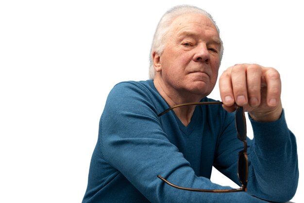 Studio portrait of elderly man with sunglasses