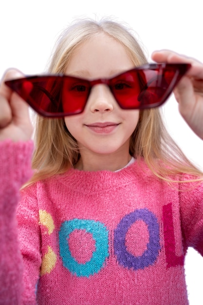 Studio portrait of young girl with cool sunglasses