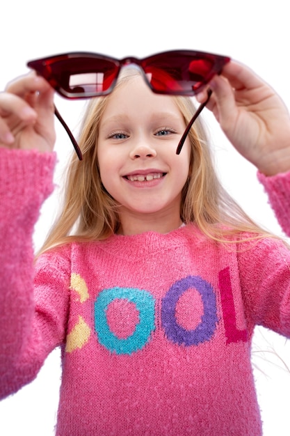 Studio portrait of young girl with cool sunglasses