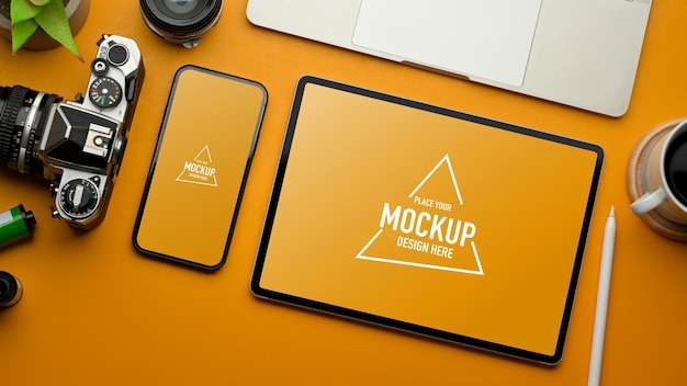 Stylish flat lay workspace with tablet and smartphone mockup