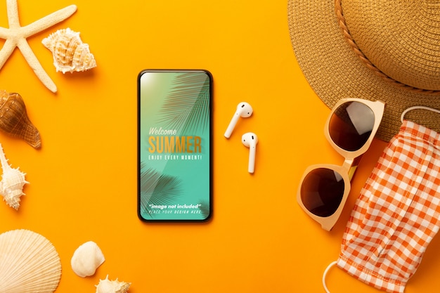 summer scene with phone mockup and beach accessories, mask