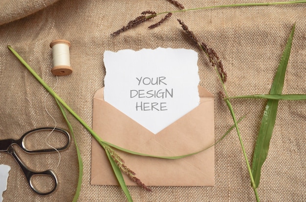 Summer stationery mockup scene with herbs, vintage spool on beige