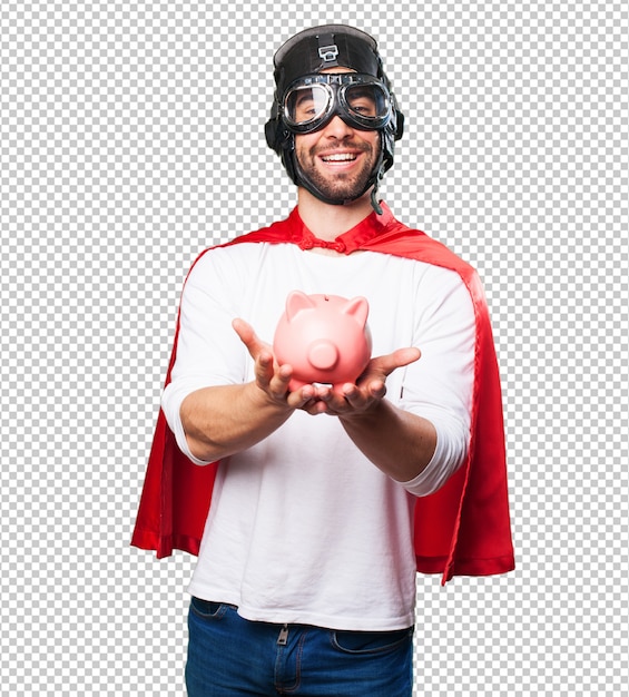 Super hero holding a piggy bank