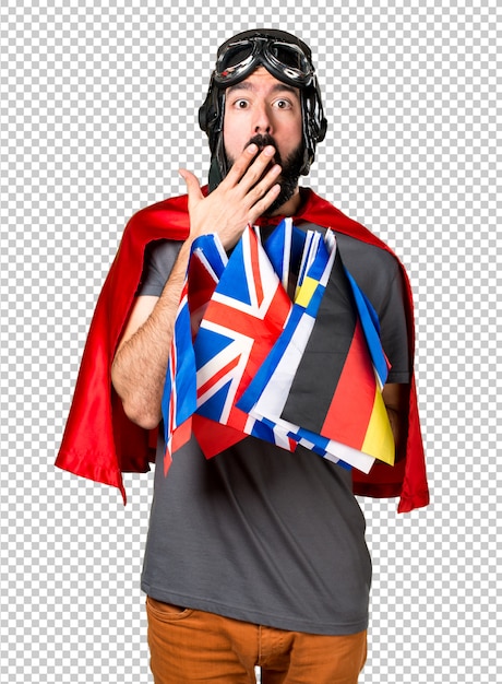 Superhero with a lot of flags making surprise gesture