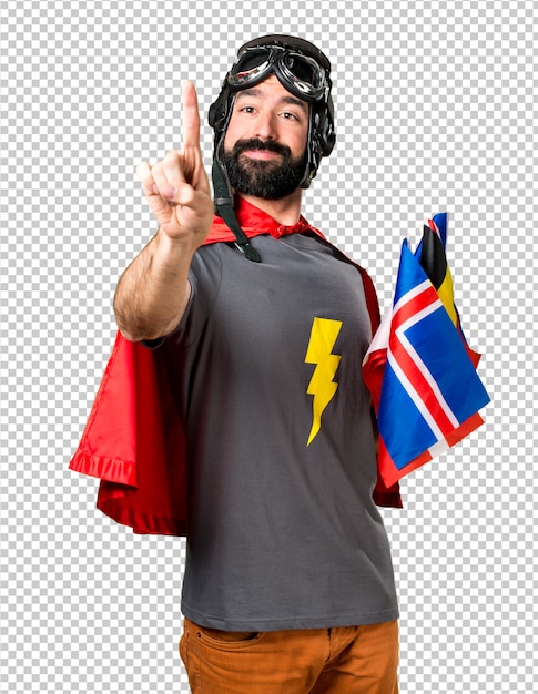 PSD superhero with a lot of flags touching on transparent screen