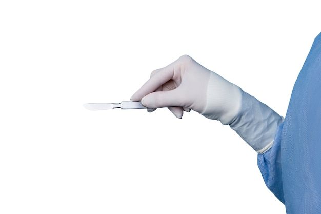 Surgical scalpel held by hand with glove