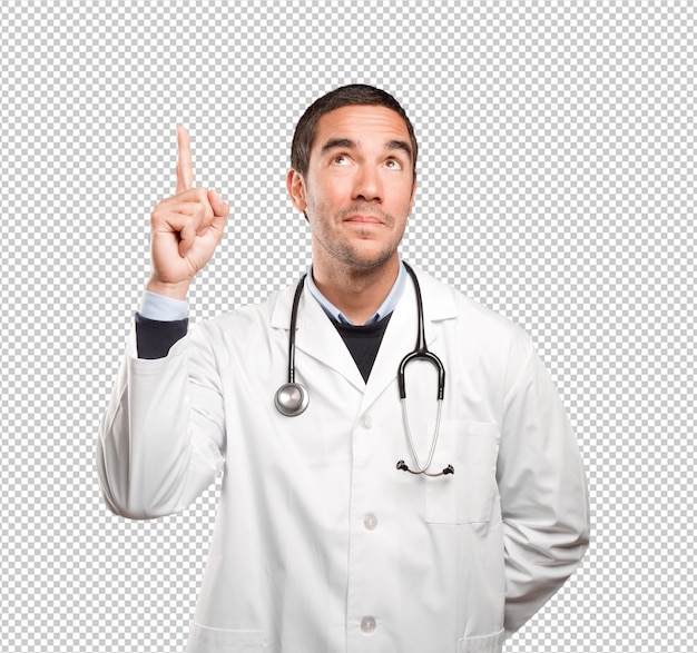 Surprised doctor pointing up