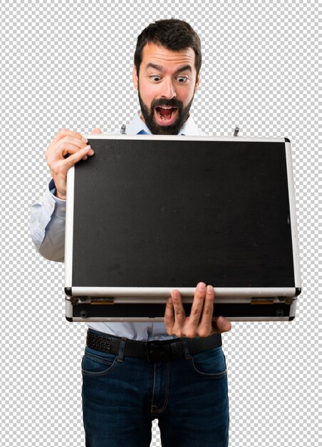 Surprised Handsome man with beard holding a briefcase