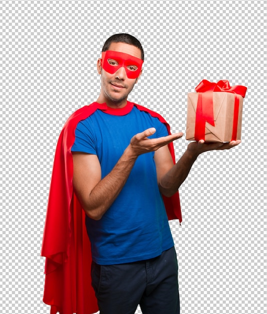 Surprised superhero with a gift