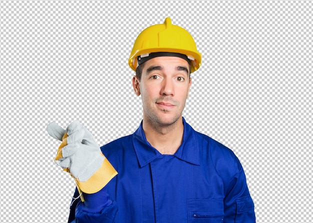 Surprised worker pointing on white background