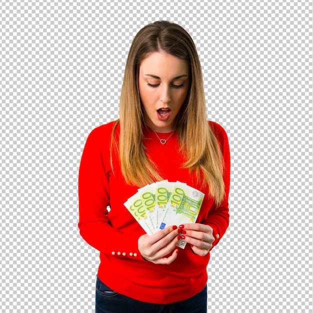 surprised young blonde woman taking a lot of money