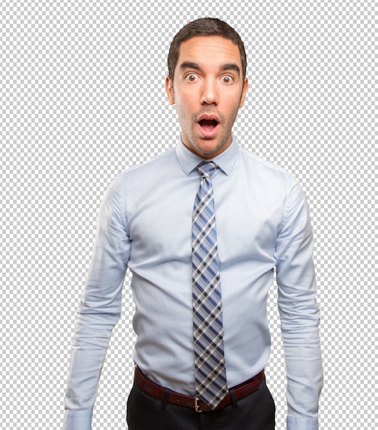 Surprised young businessman posing