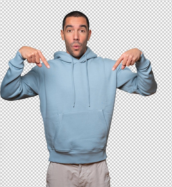 surprised young man pointing down