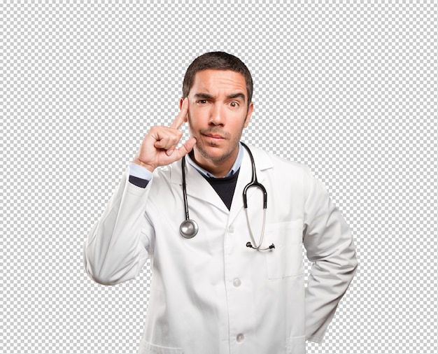 suspicious doctor against white background