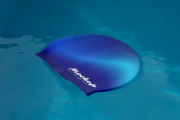 PSD swimming cap over water mockup