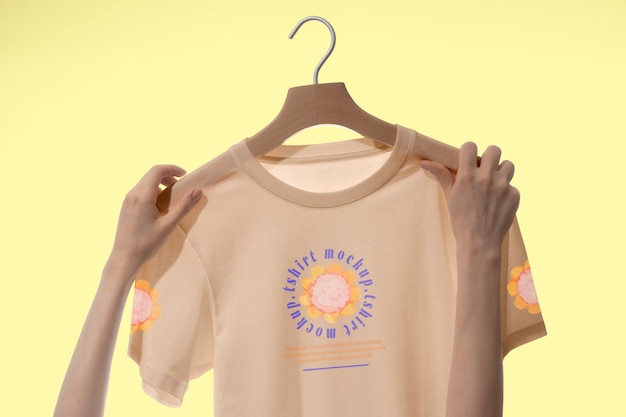 t-shirt mock-up held by human hands