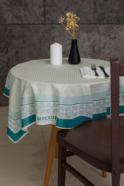 PSD tablecloth mock-up design on table indoors