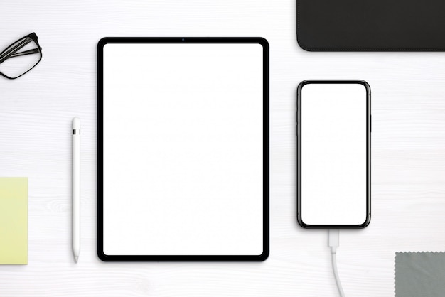 tablet and phone mockup on desk. top view, flat lay scene with separated layers