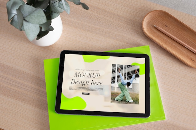 PSD tablet mock-up with wooden furniture scene