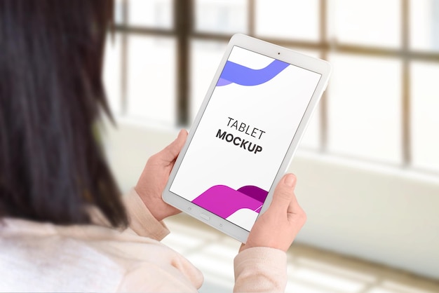 tablet mockup in woman hads vertical