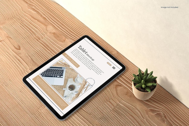 PSD tablet mockup on the wooden table