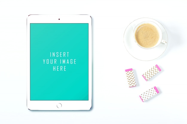 Tablet on white background with coffee mock up