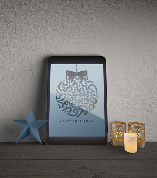 PSD tablet with christmas decorations beside