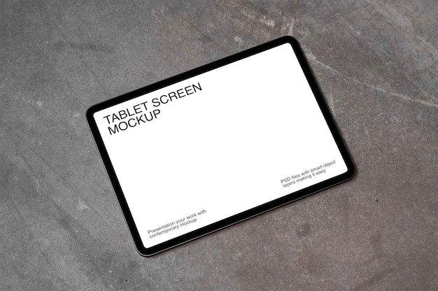 PSD tablet with screen mockup on concreate wall